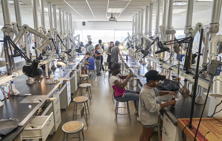 An image of students creating jewelry 在 classroom